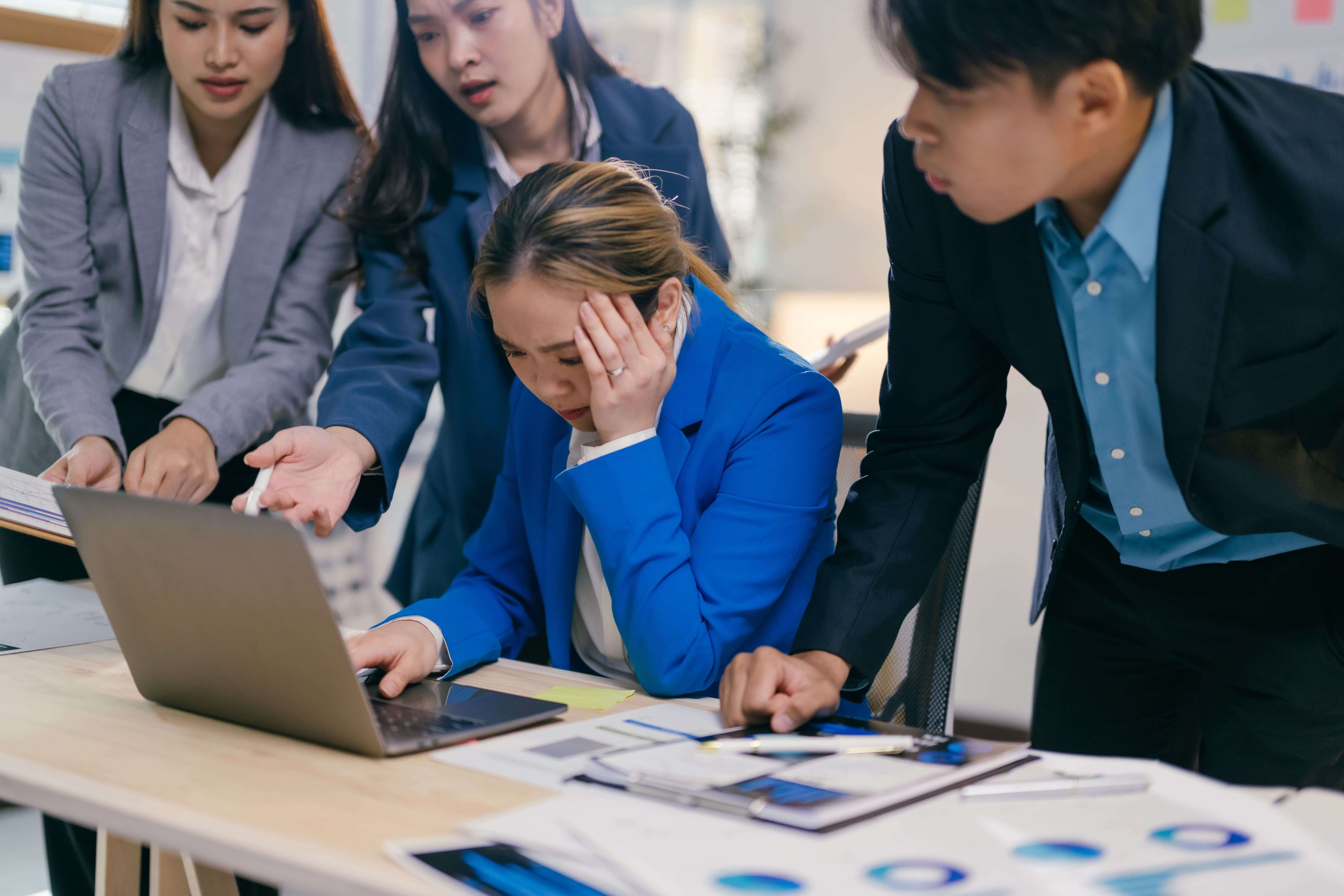 Businesswoman feeling overwhelmed and stressed