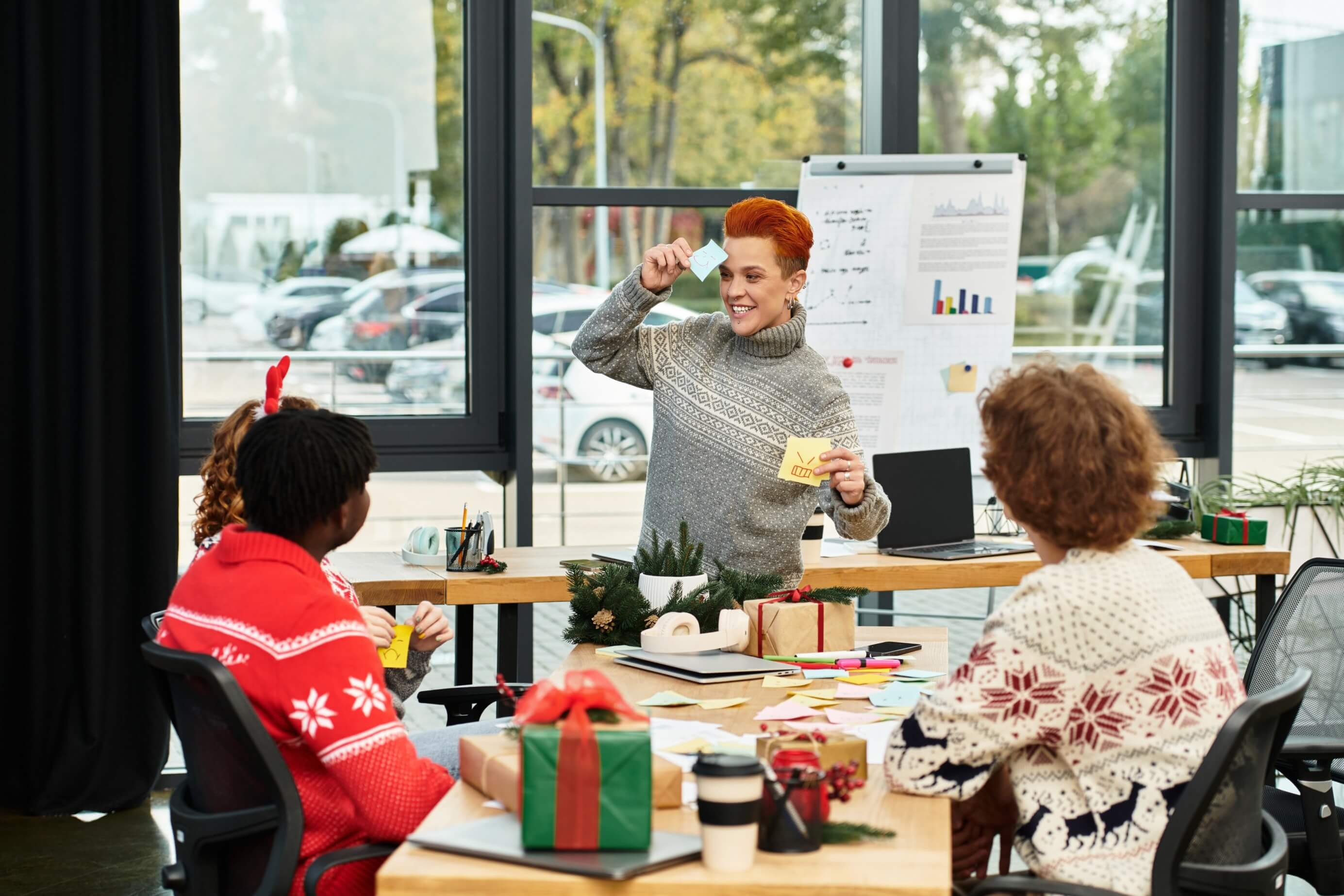 Workers joyfully celebrating christmas festive decorations office