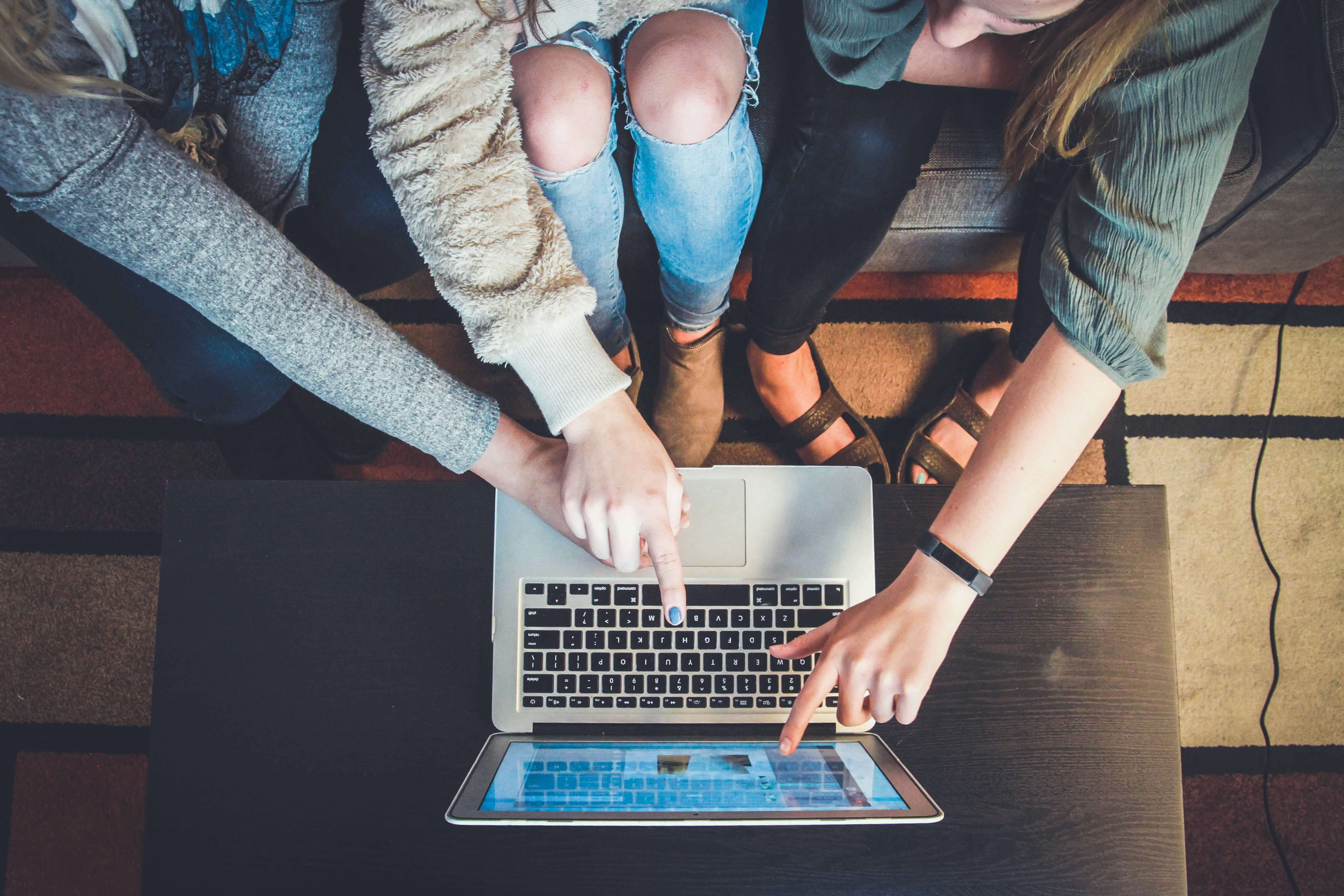 Women pointing laptop screen