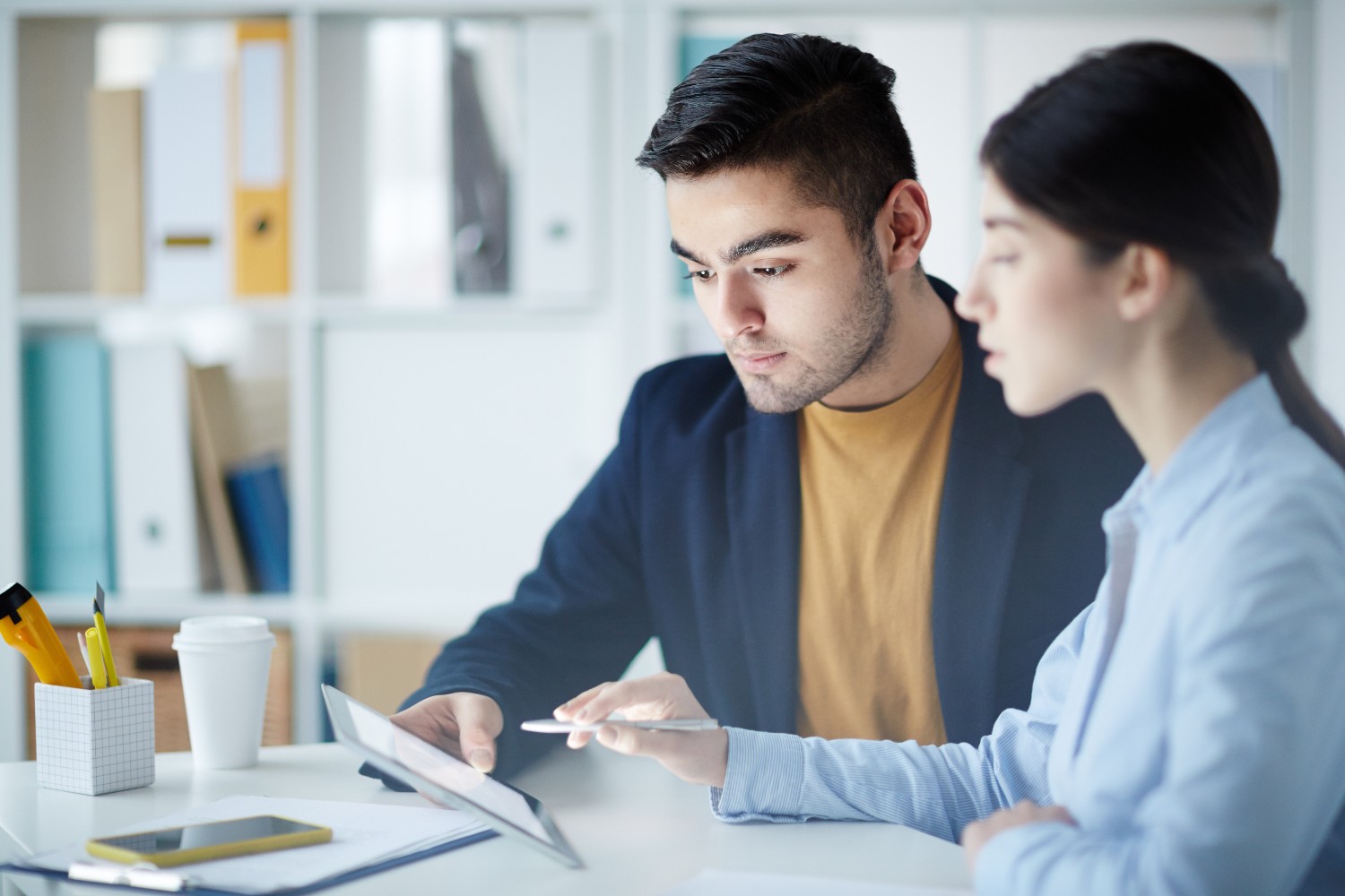 Business colleagues reviewing financial reports office
