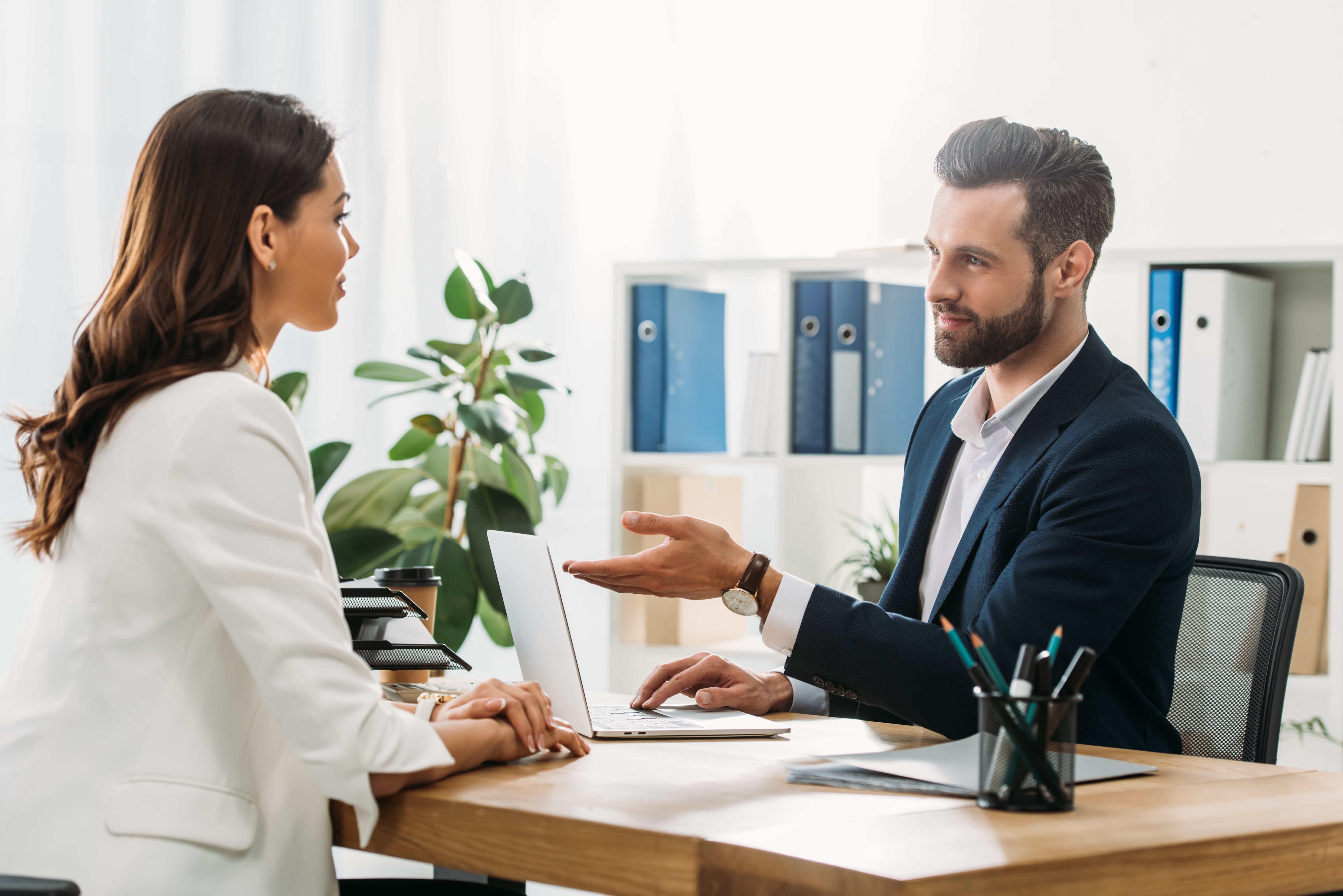 Handsome advisor suit talking with employee
