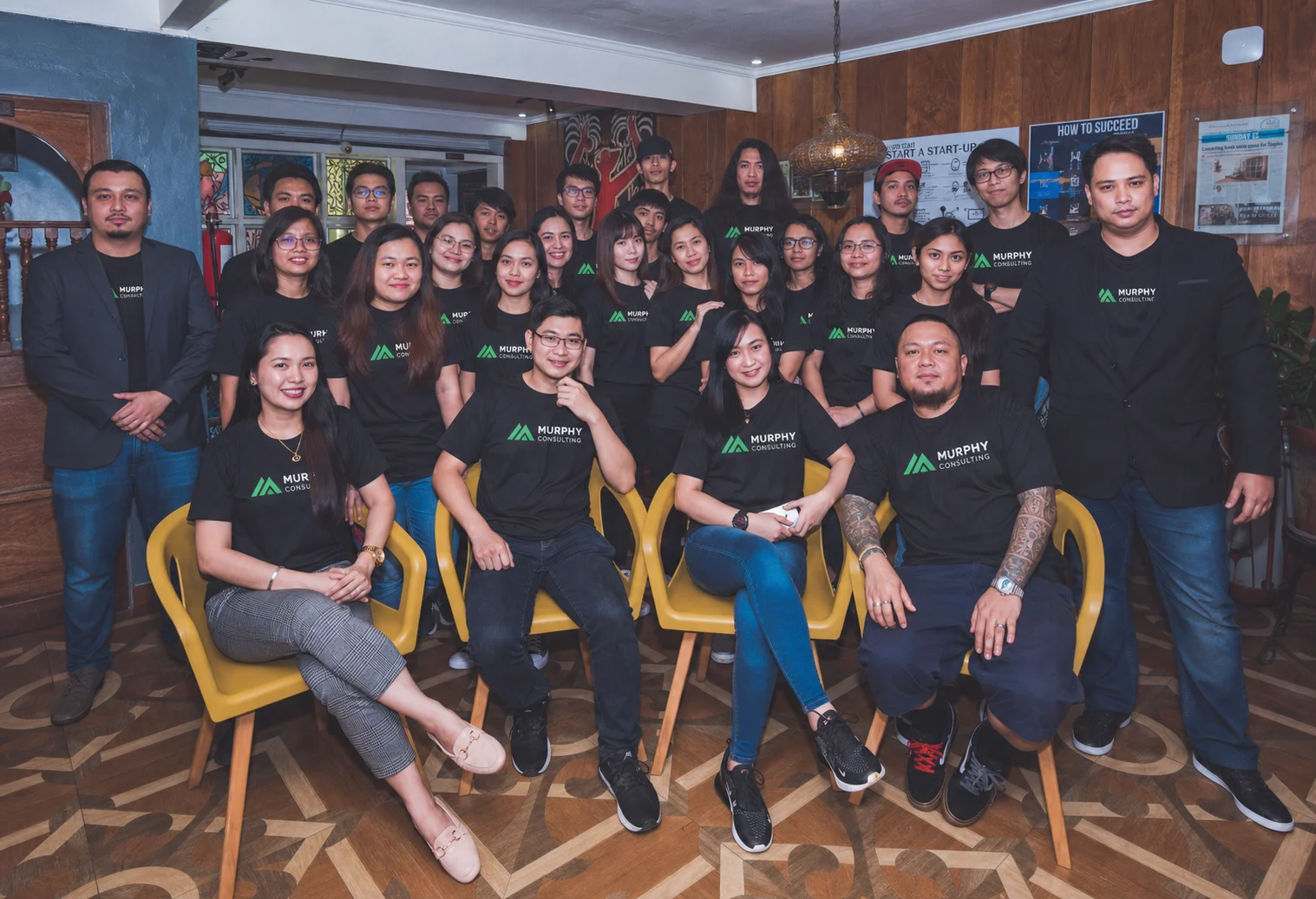 Murphy Consulting team gathered in branded shirts
